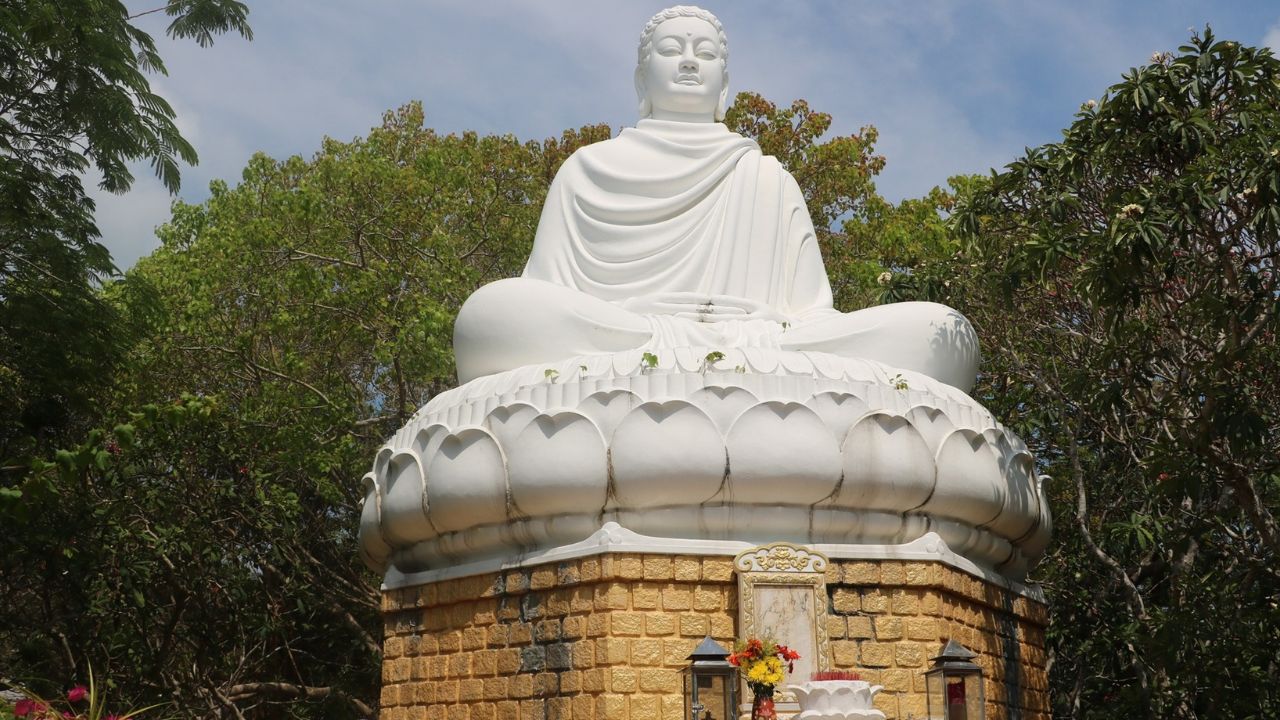 Admire the Buddha statue at Thich Ca Buddha Platform & White Palace